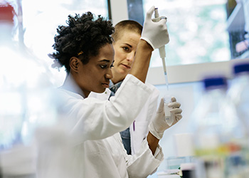 Two women in lab setting