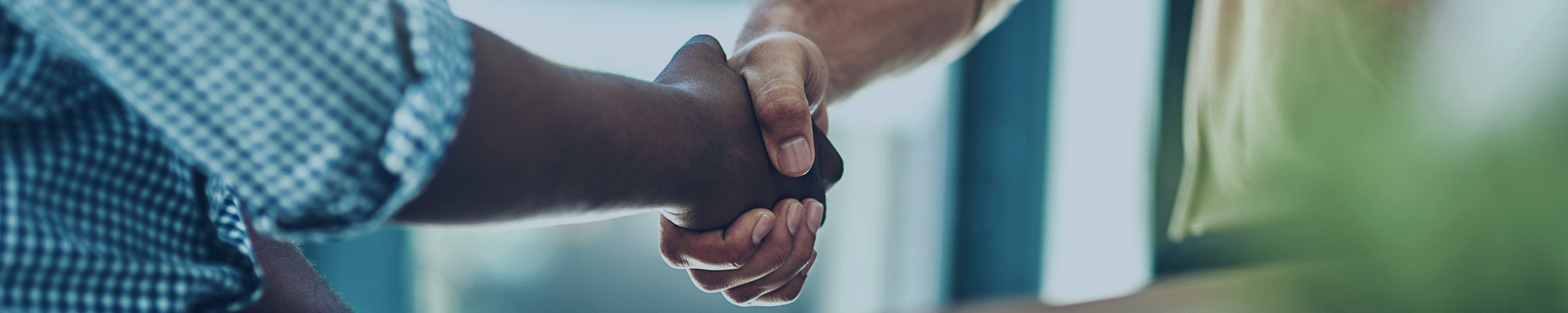 Stock photo of people shaking hands