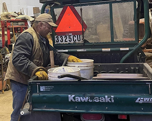 Cebery performs tasks around the farm using his Kawasaki UTV provided by DVR.