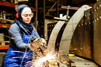 Lady using an idustrial grinder